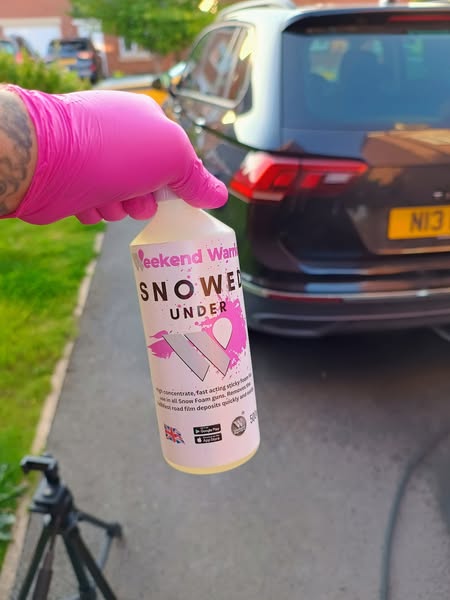 Weekend Warrior snow foam vehicle cleaning product in use on a car